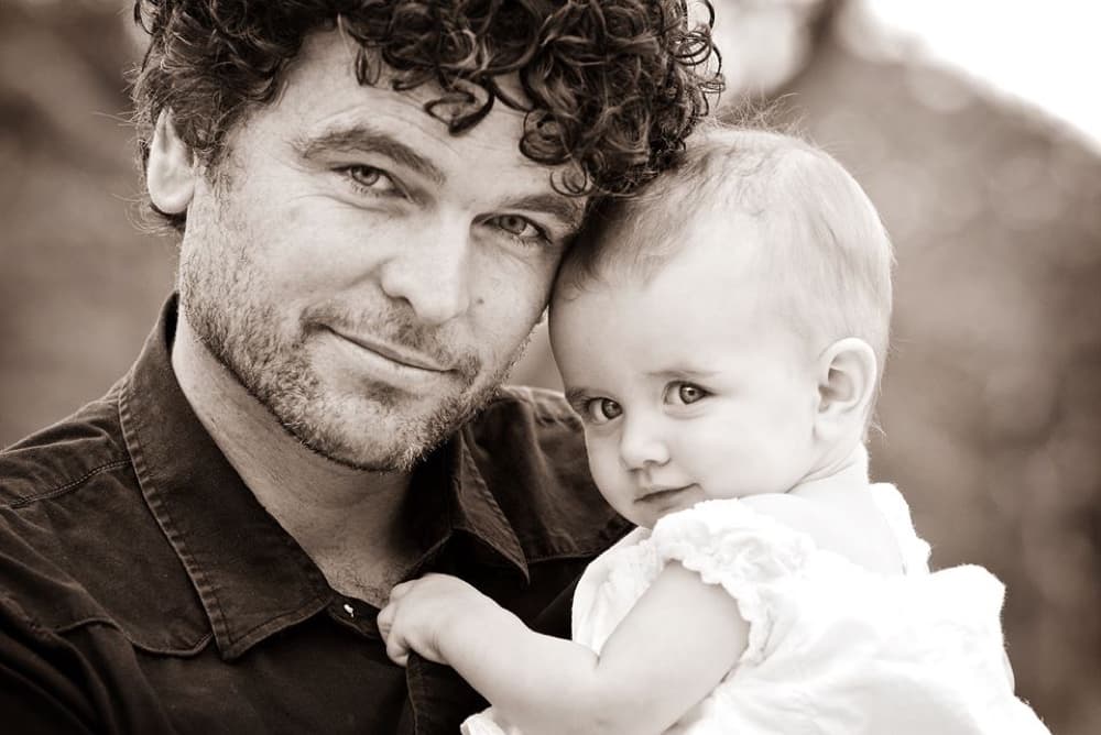 Troy Townsin holding his baby daughter Lexi